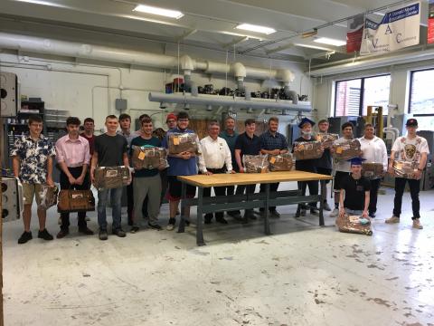 Curtis Lumber presents WSWHE BOCES construction trade students with Tool Bags