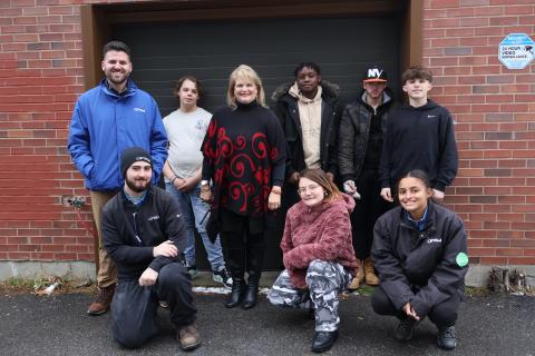 Vanderheyden youth and President & CEO Karen M. Carpenter poses with Hoffman Car Wash team